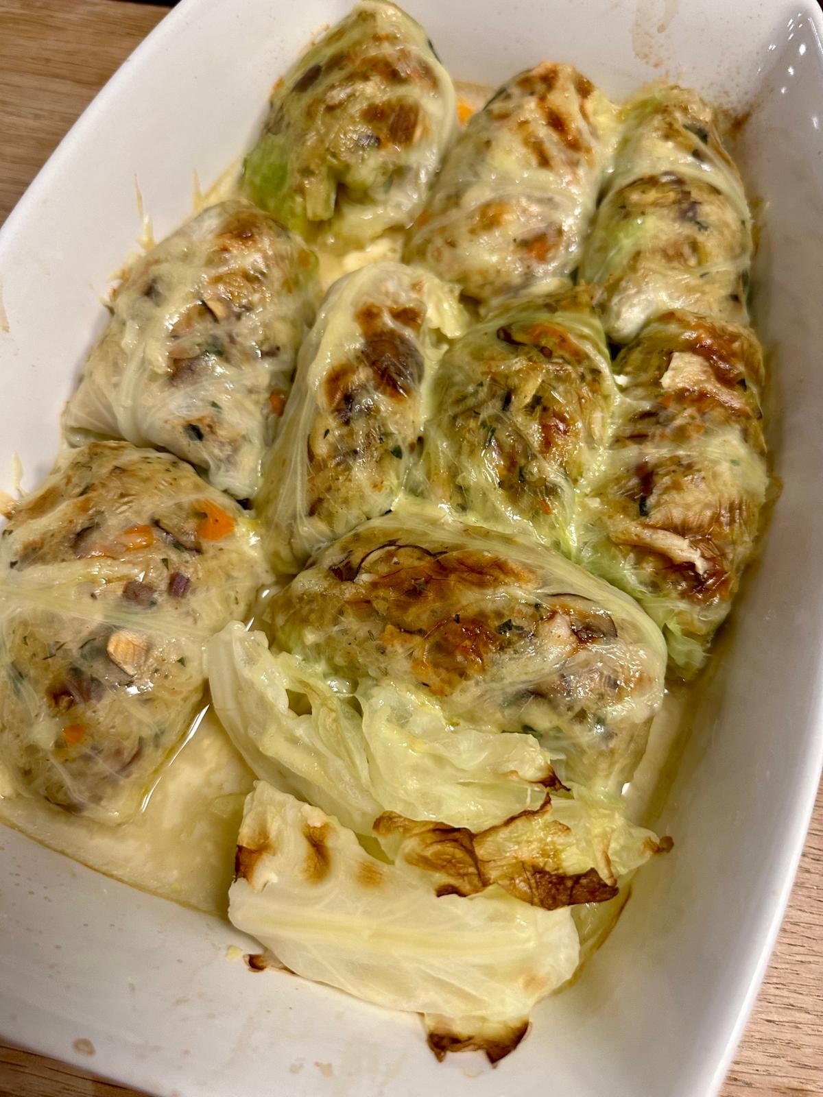 t Käse überbackene Krautrouladen